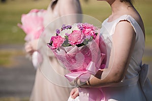 Edding bouquet in bride`s hands photo