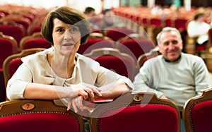 Ederly couple watching play in the theater