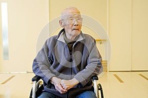 Ederly man sitting on wheelchair
