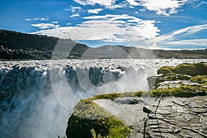 On the edge of Detifoss waterfall in Iceland