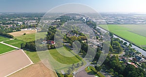 Edge of Dutch City Emmeloord, with Gas Station and Agricultural Fields - Flevoland, The Netherlands, 4K Drone Footage