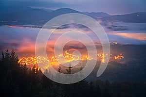 On the edge of an inversion in the Black Forest, the golden lights of the small village of Michelbach light up the night
