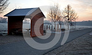 Edge of the river asphalt road, where the bike path goes. the early traveler leaned on the touring bicycle. sports ground outdoor