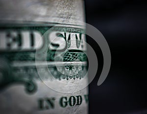 Edge of US Dollar Bill Focused on God