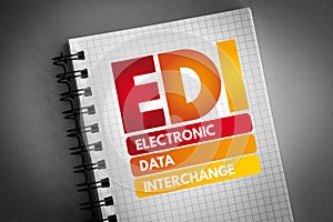 EDI - Electronic Data Interchange acronym on notepad, business concept background