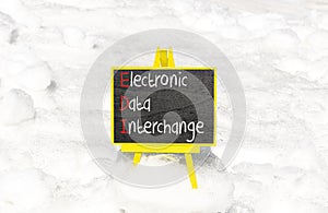 EDI electronic data interchange symbol. Concept words EDI electronic data interchange on blackboard. Beautiful white snow