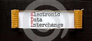 EDI electronic data interchange symbol. Concept words EDI electronic data interchange on white paper on a beautiful black