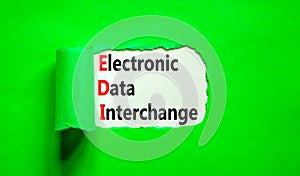 EDI electronic data interchange symbol. Concept words EDI electronic data interchange on white paper on a beautiful green