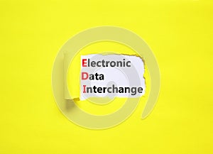 EDI electronic data interchange symbol. Concept words EDI electronic data interchange on white paper on a beautiful yellow