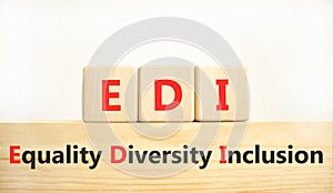 EDI equality diversity inclusion symbol. Concept words EDI equality diversity inclusion on blocks. Beautiful white background.