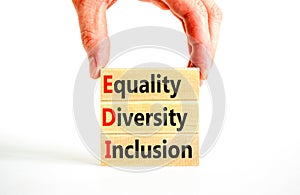 EDI equality diversity inclusion symbol. Concept words EDI equality diversity inclusion on blocks. Beautiful white background.