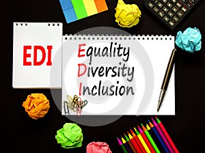 EDI equality diversity inclusion symbol. Concept words EDI equality diversity inclusion on white note. Beautiful black background