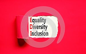 EDI equality diversity inclusion symbol. Concept words EDI equality diversity inclusion on white paper on beautiful red background