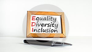 EDI equality diversity inclusion symbol. Concept words EDI equality diversity inclusion on wooden frame. Beautiful white