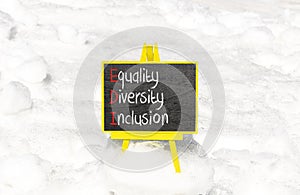 EDI equality diversity inclusion symbol. Concept words EDI equality diversity inclusion on yellow blackboard. Beautiful snow