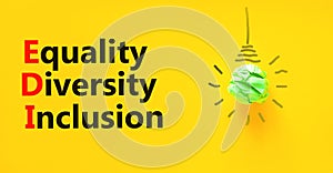 EDI equality diversity inclusion symbol. Concept words EDI equality diversity inclusion on yellow paper on beautiful yellow