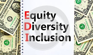 EDI equity diversity inclusion symbol. Concept words EDI equity diversity inclusion on white note. Beautiful dollar bills