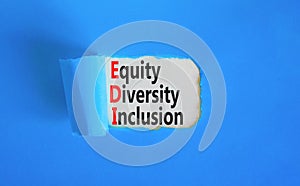 EDI equity diversity inclusion symbol. Concept words EDI equity diversity inclusion on white paper on beautiful blue background.