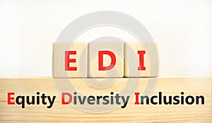 EDI equity diversity inclusion symbol. Concept words EDI equity diversity inclusion on wooden blocks. Beautiful white background.