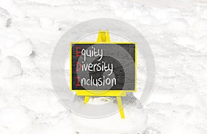 EDI equity diversity inclusion symbol. Concept words EDI equity diversity inclusion on yellow blackboard. Beautiful white snow