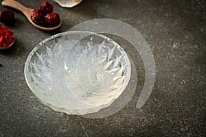 Edible bird`s nest soup in glass bowl