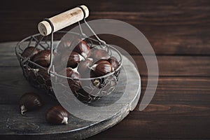 Edible chestnuts in a metal basket