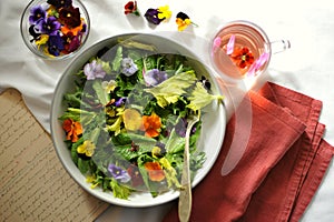 Edible flowers salad and flower tea as a healthy and happy Sunday snack or brunch