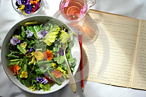 Edible flowers salad and flower tea as a healthy and happy Sunday snack or brunch