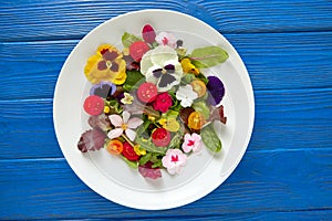 Edible flowers salad in a plate