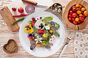 Edible flowers salad in a plate