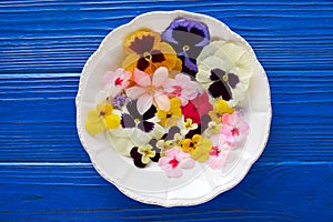 Edible flowers salad in a plate