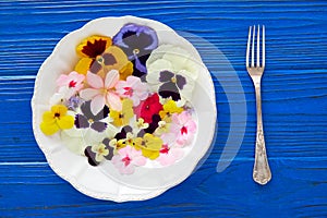 Edible flowers salad in a plate