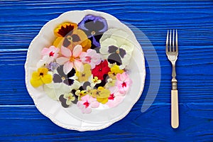 Edible flowers salad in a plate