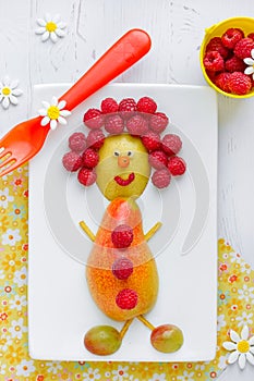 Edible funny man from fresh fruits and berries