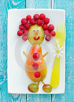 Edible funny man from fresh fruits and berries