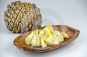 Edible part of marolo, araticum or bruto fruit on wooden bowl . Tropical fruit of the original inhabitants of Brazil and