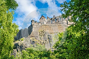 Edinburgh Castle in a summer afternoon as seen from Princes Street Gardens, Scotland.