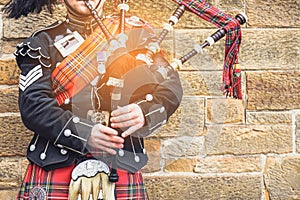 EDINBURGH, SCOTLAND, 24 March 2018 , Scottish bagpiper dressed i