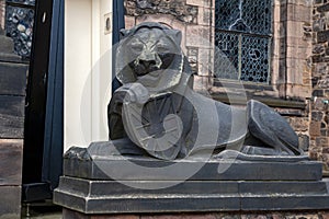 Lion sculpture at building entrance of Scottish National War Memorial inside Edinburgh Castle, Scotland, UK