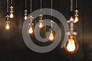 Edison light bulbs in front of a wooden wall