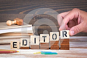 Editor concept. Wooden letters on the office desk, informative and communication background