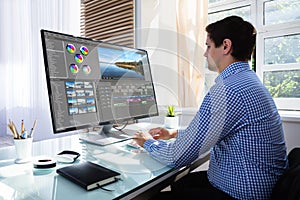 Editor editing video on computer