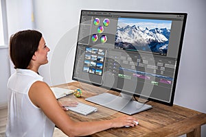 Editor Editing Video On Computer