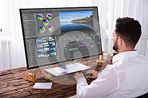 Editor Editing Video On Computer photo
