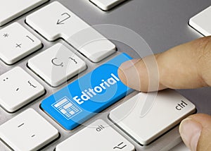 Editorial - Inscription on Blue Keyboard Key