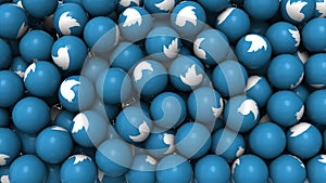 Editorial shot: filled screen 3D rendering blue balls with white icon bird. Round spheres with logo of the social