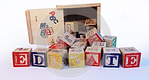 Educate spelled on preschool alphabet blocks