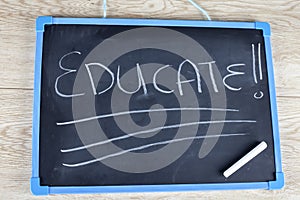 Educate written on a chalkboard