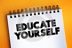 Educate Yourself text on notepad, concept background