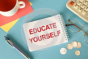 Educate Yourself is written on a notepad